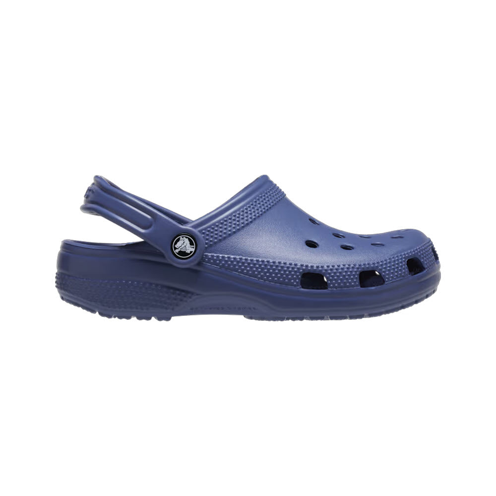 A single blue Crocs Classic Clog Bijou Blue - Womens with ventilation holes and a pivoting heel strap, isolated on a white background.