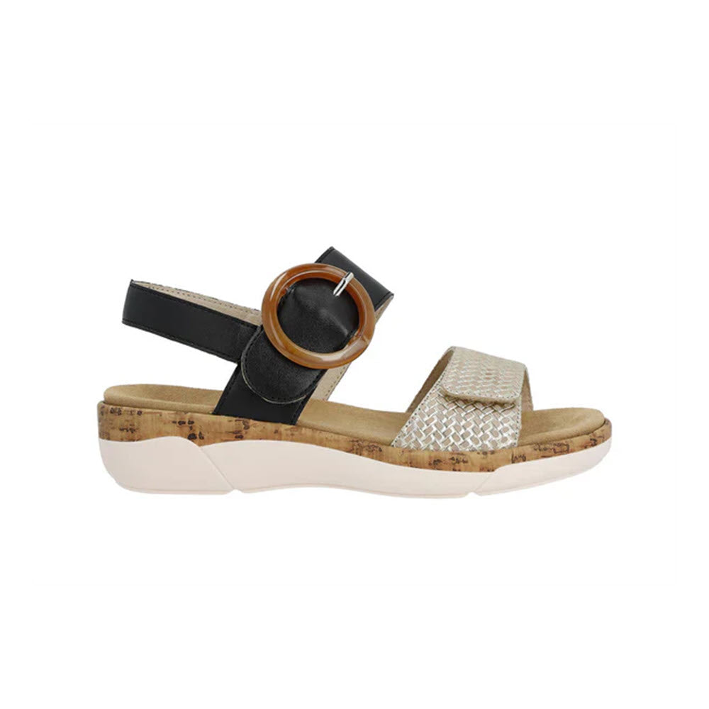 A Remonte women&#39;s sandal with a cork sole, featuring black and metallic straps and a circular buckle, displayed on a white background.