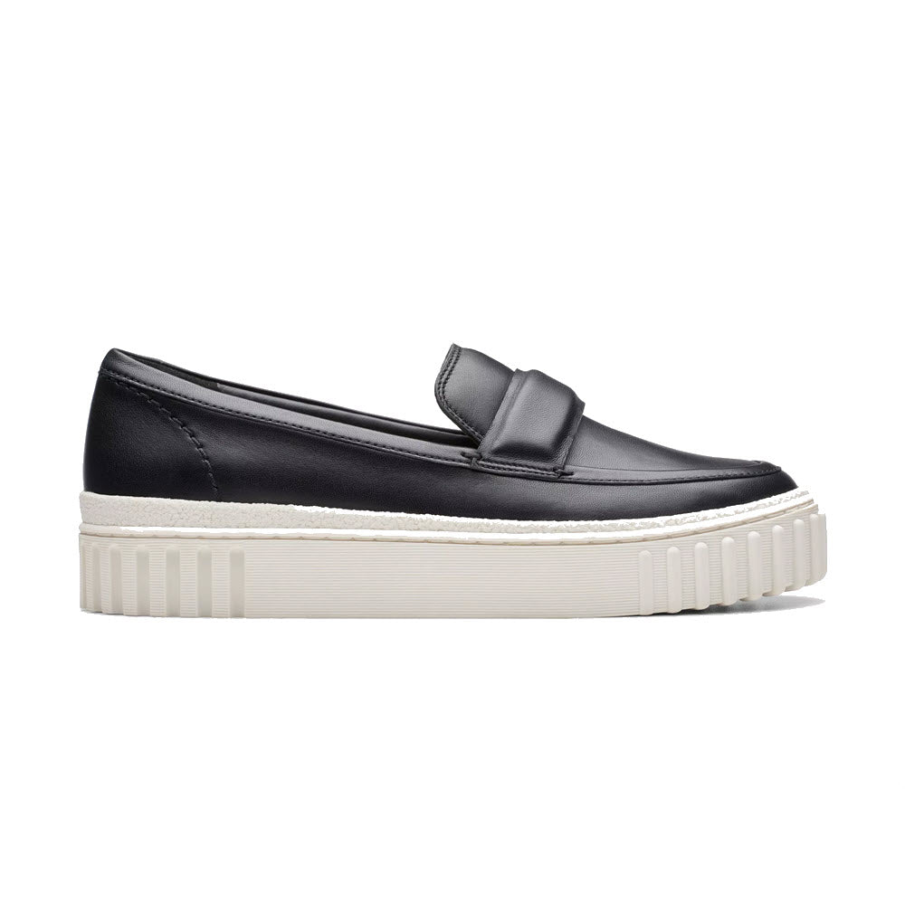 Clarks Mayhill Cove black leather loafer with a chunky white sole and a bow on top, displayed on a plain background.
