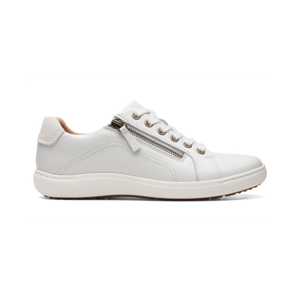 A Clarks Nalle Lace White sneaker with laces and a diagonal zipper, featuring a high-grip rubber sole, displayed against a plain white background.