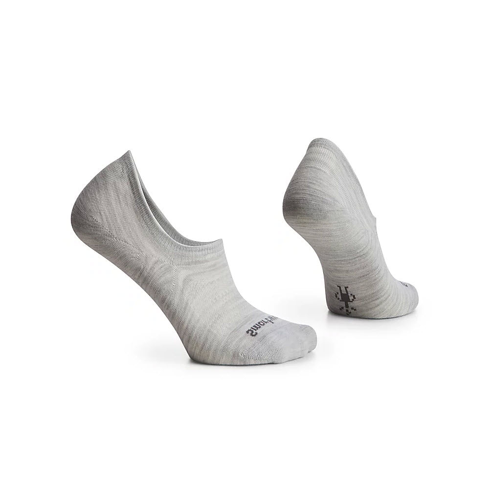 A pair of light gray, Smartwool no-show sport socks made from Merino wool, with a reinforced heel and visible branding on the side, displayed against a white background.