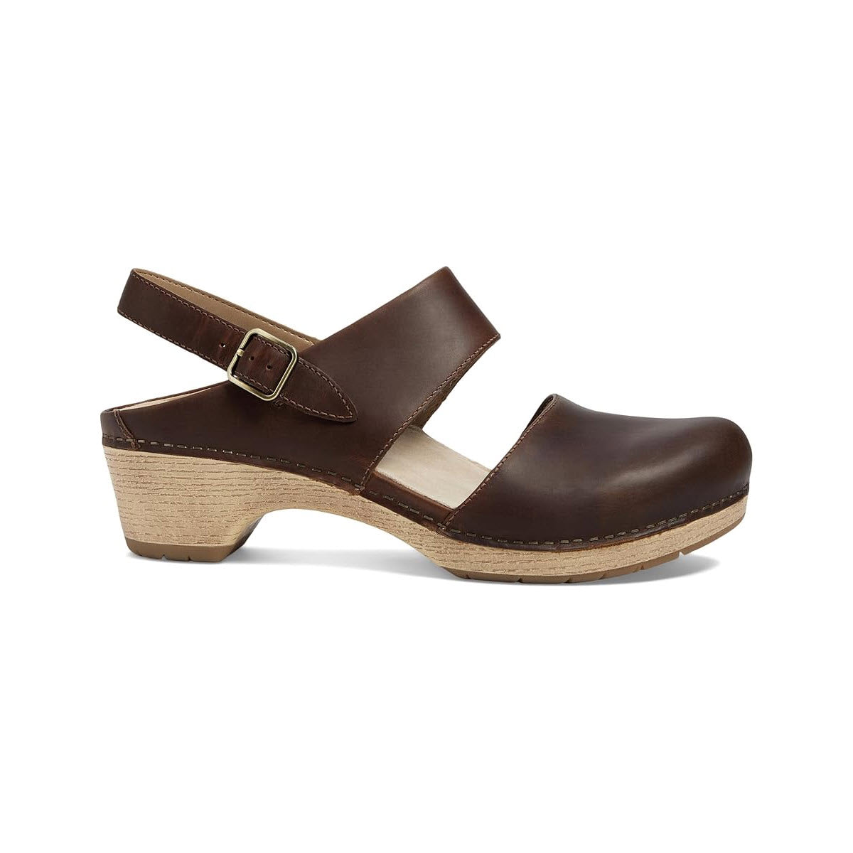 A brown leather closed-toe clog with a buckle strap, wooden heel, and stitched detailing, isolated on a white background is the Dansko Lucia Tan - Womens.