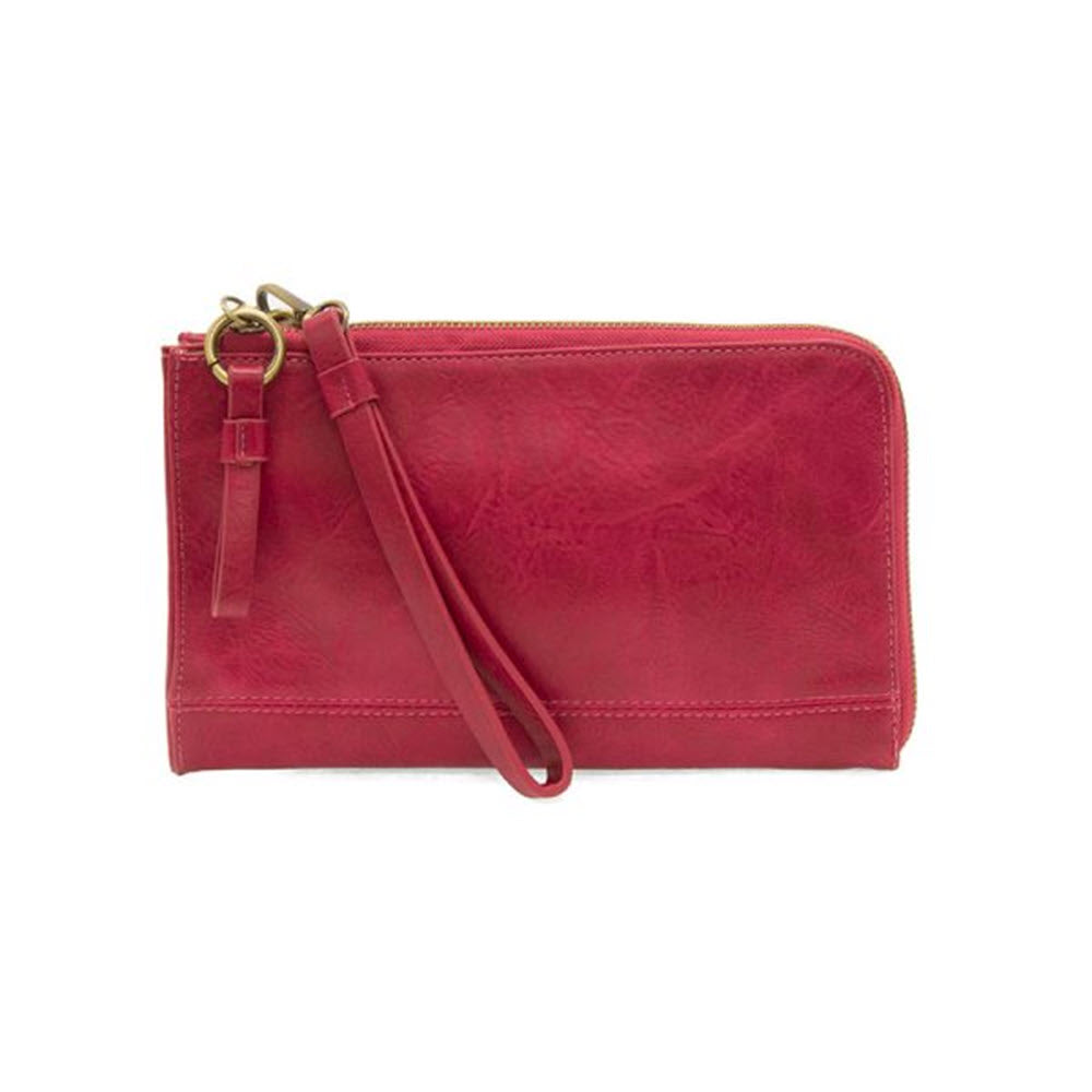 A red JOY SUSAN KARINA CROSSBODY WILD BERRY wristlet with a zipper closure and a strap, isolated on a white background.