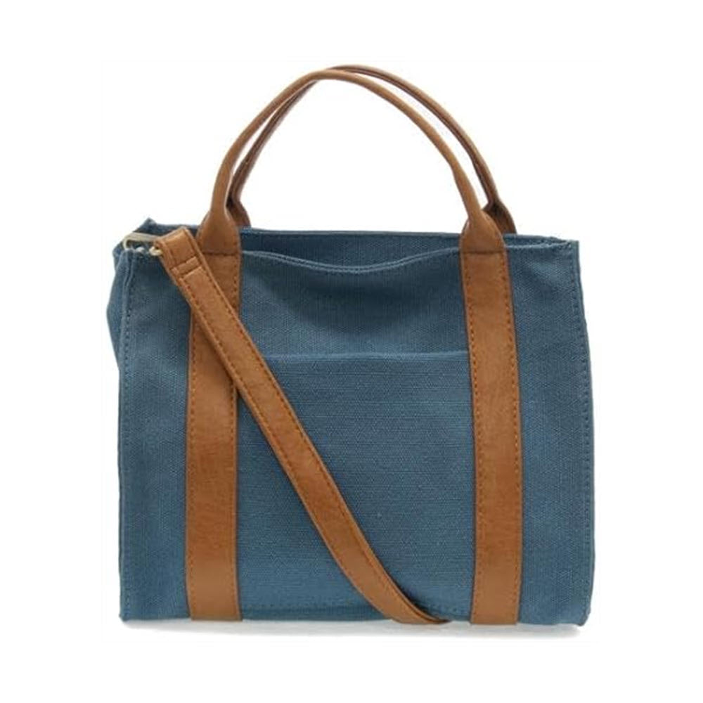 JOY SUSAN GWEN MEDIUM CANVAS TOTE COASTAL BLUE tote bag with brown vegan leather handles and a shoulder strap, isolated on a white background.