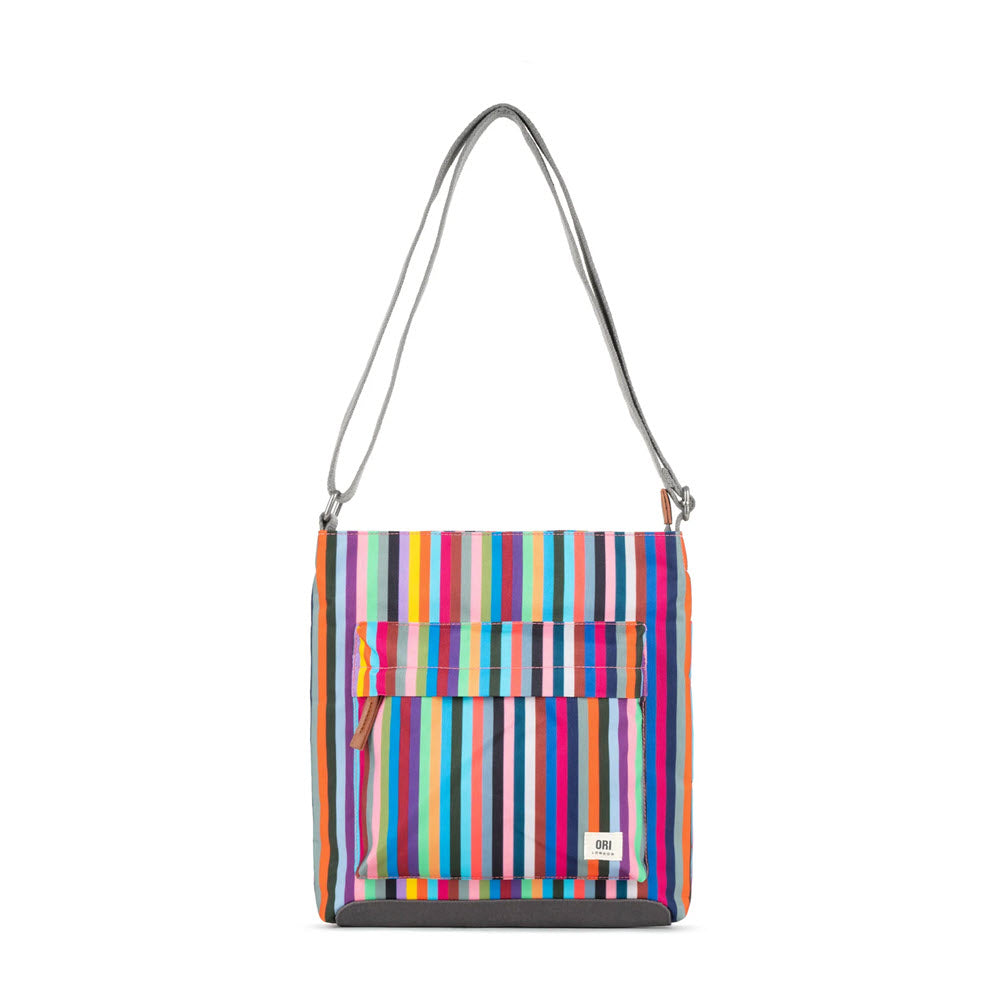 A colorful ORI KENNINGTON B CANVAS MULTI STRIPE crossbody bag with a front flap pocket and a silver chain strap, isolated on a white background by Ori London.