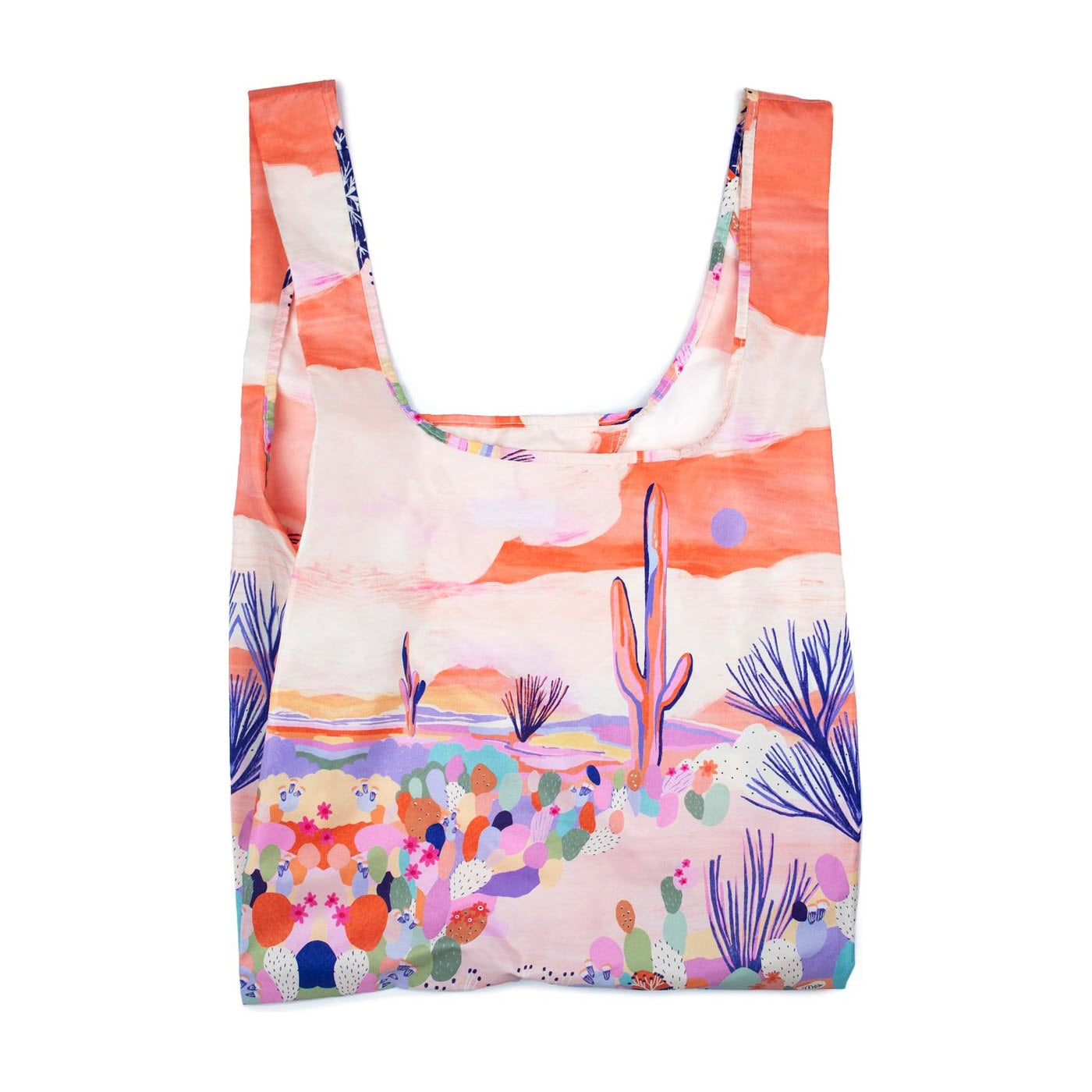 Colorful desert-themed tote bag with vibrant prints of cacti and floral patterns, featuring pink and blue hues on a white background. This eco-friendly KIND MEDIUM SHOPPER MARINA CARNIVAL by Kind Bags is crafted to offer a large capacity for your.