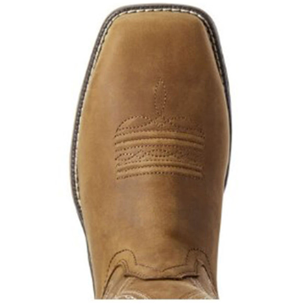 Close-up of the top view of a tan leather cowboy boot showing detailed stitching and design on the toe, featuring a Ariat DRYShield™ waterproof breathable construction.
