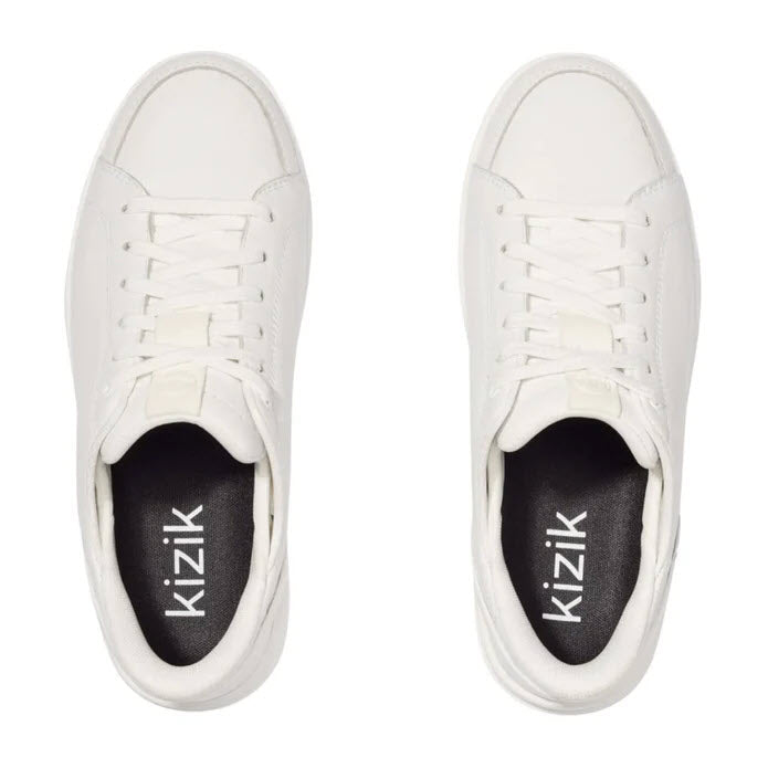 A pair of KIZIK SYDNEY WHITE - WOMENS sneakers, viewed from above, displayed on a plain background.