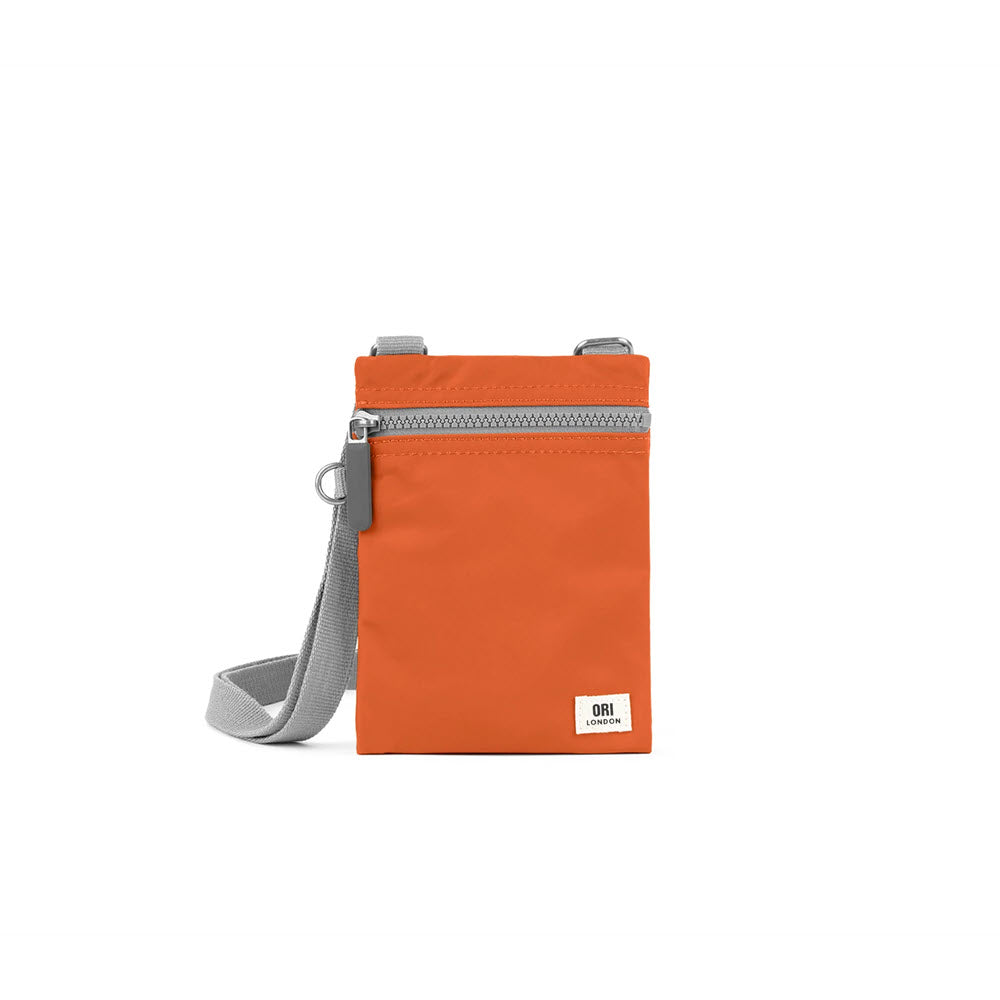 ORI LONDON CHELSEA CROSSBODY BURNT ORANGE shoulder bag with a zip closure and an adjustable grey strap, displayed against a plain white background.