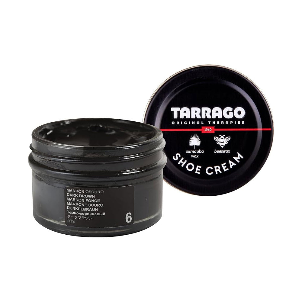A jar of F.L. Inc Tarrago Shoe Cream Black, partially open with its lid beside it displaying the logo and product details.