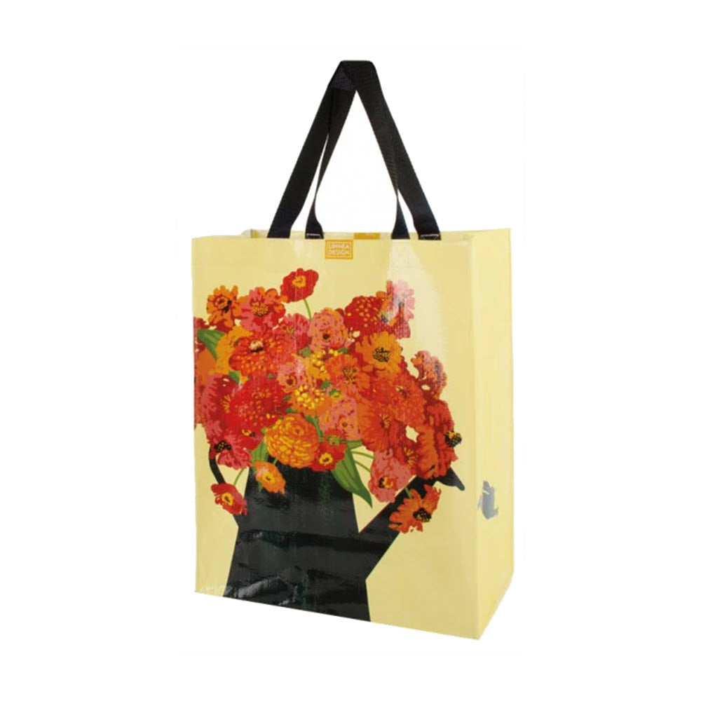 LINNEA VERTICAL MARKET TOTE ZINNIA by Linnea featuring a vibrant floral print on a pale yellow background with black handles.