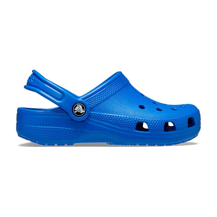 A single bright blue Crocs Classic Clog in Bolt Blue, with its strap flipped up, isolated against a white background.