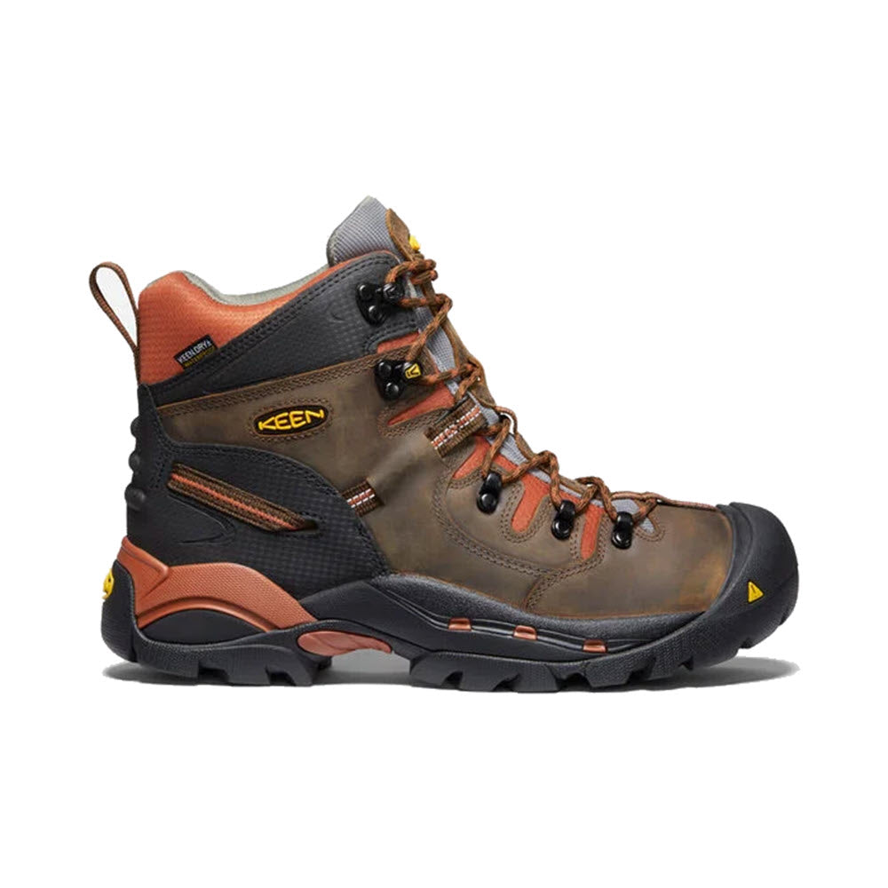 A pair of high-top, brown hiking boots with orange and black accents, featuring a Keen PITTSBURGH SOFT TOE WP CASCADE BROWN - MENS waterproof breathable membrane.