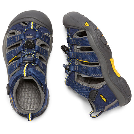 A pair of Keen Newport Blue Depths - Kids children&#39;s summer sandals with an adjustable hook and loop strap and a closed toe, designed for superior traction.