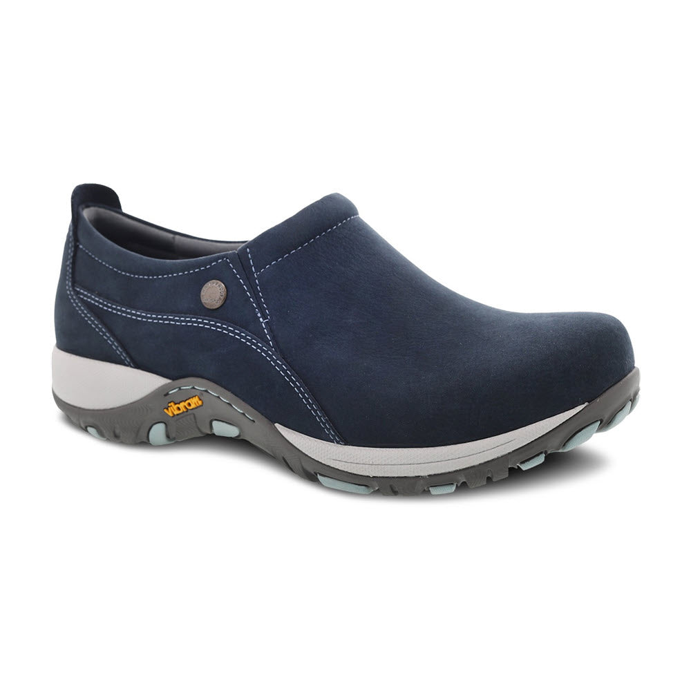 A single DANSKO PATTI NAVY MILLED NUBUCK slip-on shoe with a grey and teal, slip-resistant Vibram® sole.
