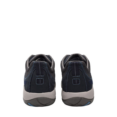 A pair of navy blue Dansko Paisley milled nubuck athletic shoes viewed from the back, featuring a Vibram rubber outsole.