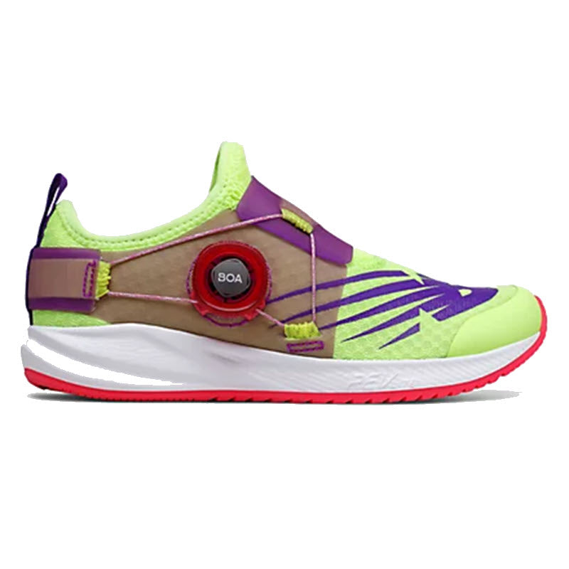 A side view of a New Balance FuelCore Reveal Boa Lime/Pink - Kids athletic shoe featuring a Boa® Fit System, with vibrant green, purple, and red accents on a white sole.