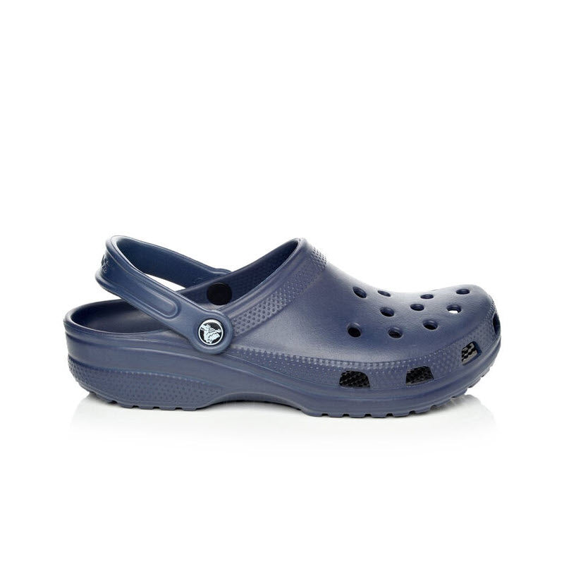 A single Crocs Classic Clog Navy - Womens shoe made of Croslite material, against a white background.
