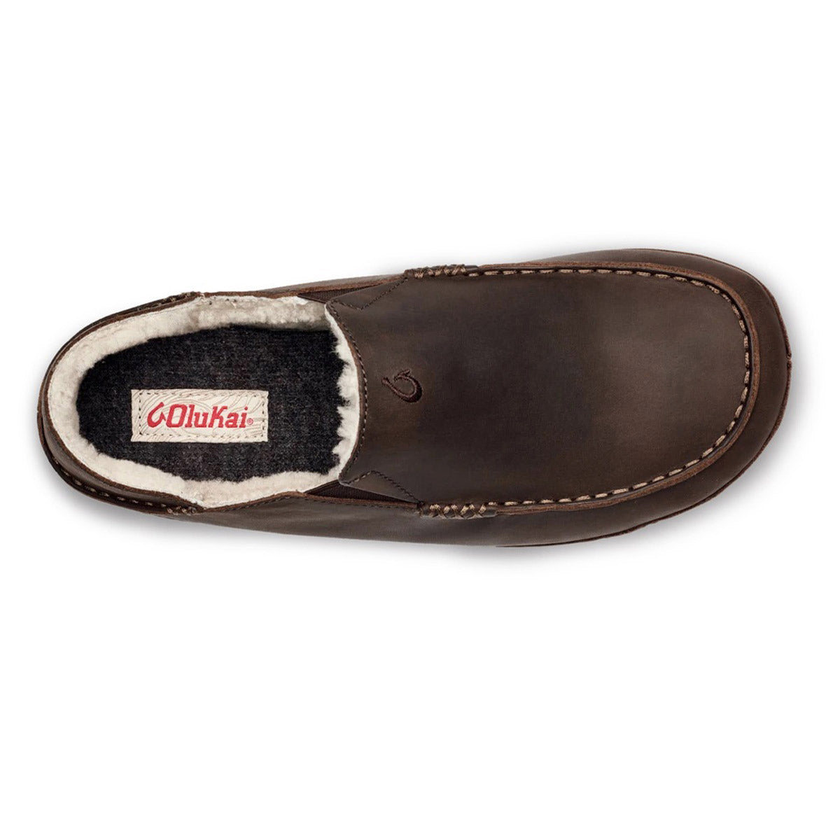 Top view of a single brown nubuck leather slipper with a shearling lining and a visible Olukai Moloa Slipper Dark Wood - Mens brand label.