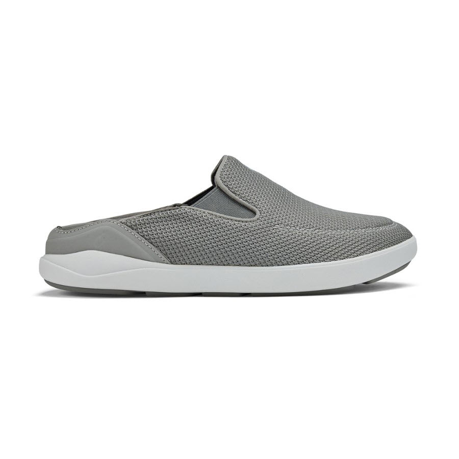 A single grey slip-on Olukai Nohea Pae sneaker with removable washable footbeds and a white sole against a white background.