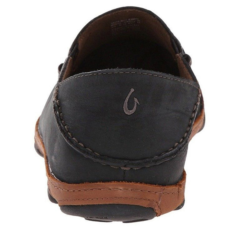 Rear view of a black and brown Olukai Moloa Slip-On shoe with a stitched detail, nubuck leather, and a small logo.