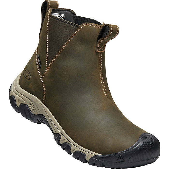 A Keen Greta Chelsea Olive/Timberwolf - Womens ankle-high, waterproof boot with an elastic side panel, a pull-on loop at the back, and a Thermal Heat Shield insole.