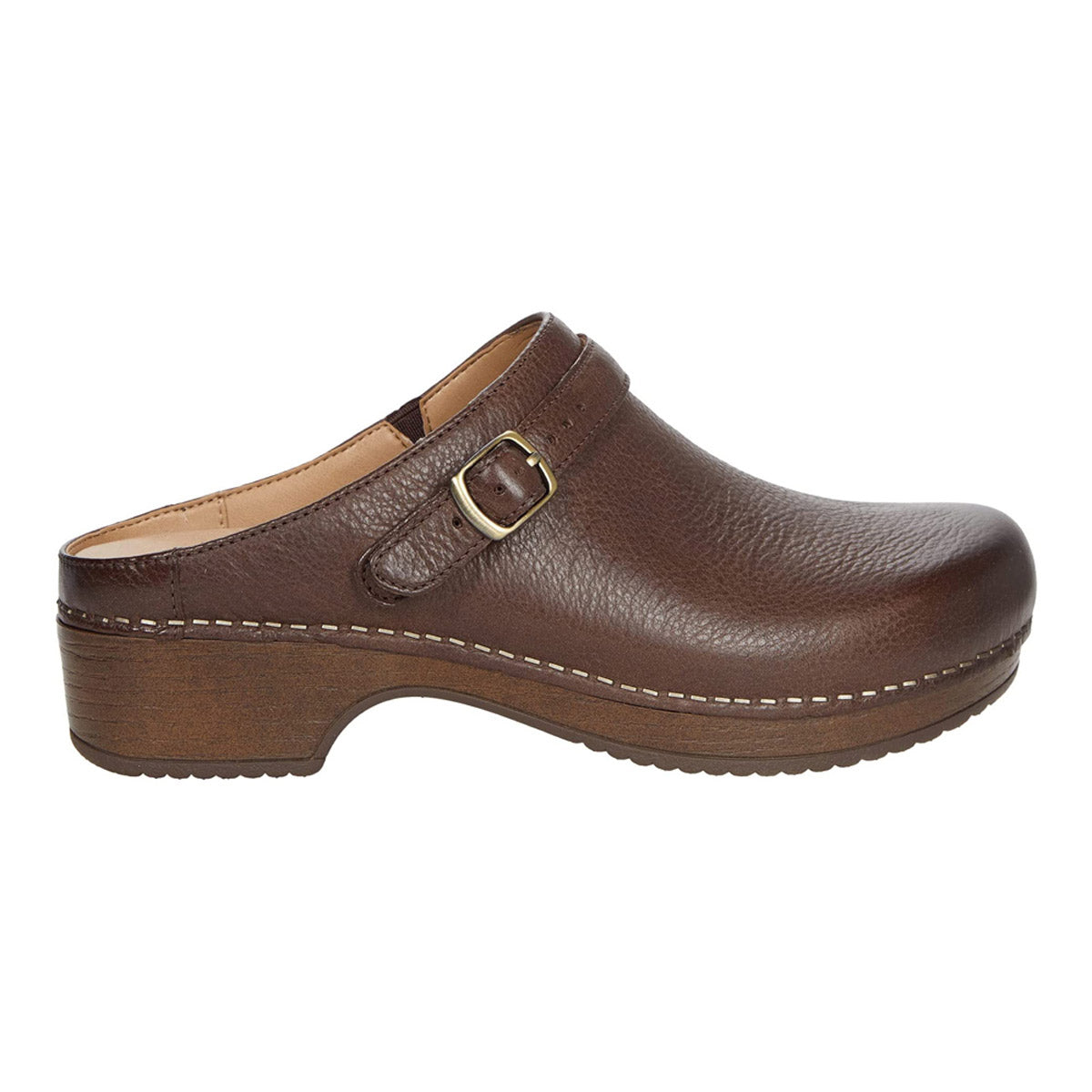 Brown leather Dansko Berry Mule with buckle detail on a white background.
Product Name: Dansko Berry Brown Milled Burnished - Womens
Brand Name: Dansko