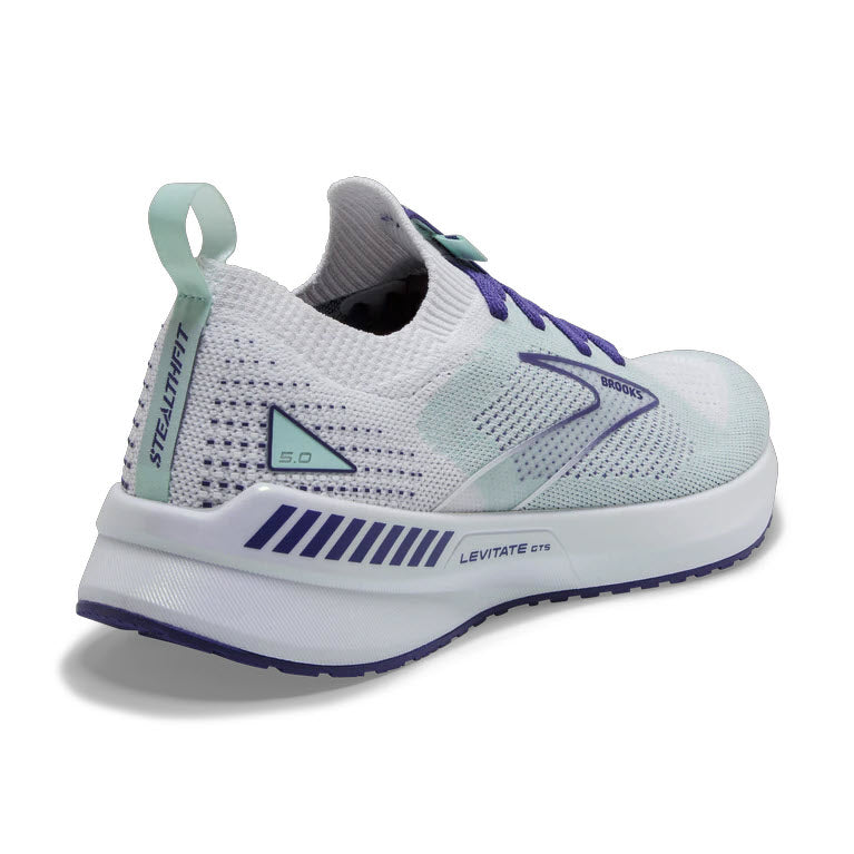 A modern Brooks Levitate Stealthfit GTS 5 White/Navy running shoe with white and purple accents on a white background.