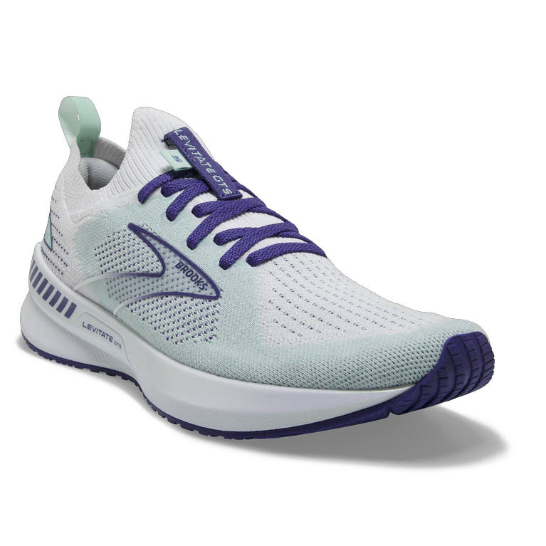 A white and purple Brooks Levitate Stealthfit GTS 5 White/Navy running shoe with GuideRails® support on a white background.
