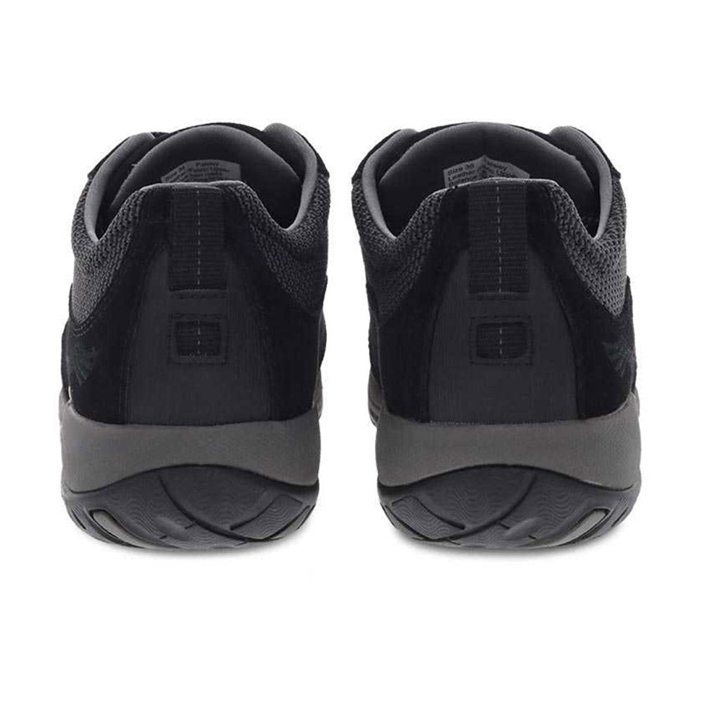 A pair of Dansko Paisley Black/Black Suede - Women sneakers viewed from the heel side.