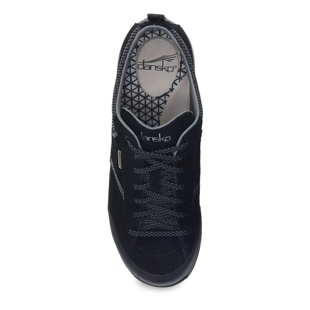 Top view of a DANSKO PAISLEY BLACK/BLACK SUEDE - WOMEN sneaker with branding on the insole and waterproof leather uppers.