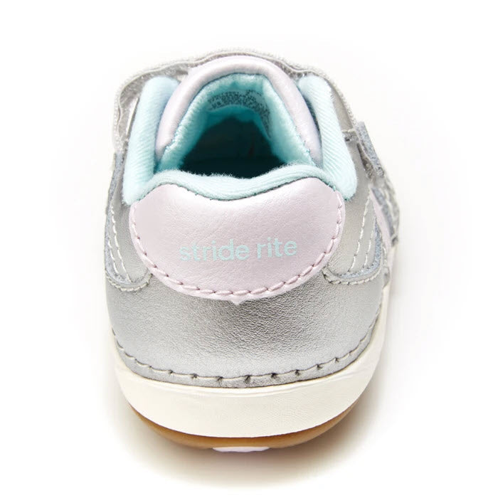 A front view of a child&#39;s Stride Rite SRT SM Artie Silver soft motion shoe, showcasing a mix of blue and gray colors with white stitching.