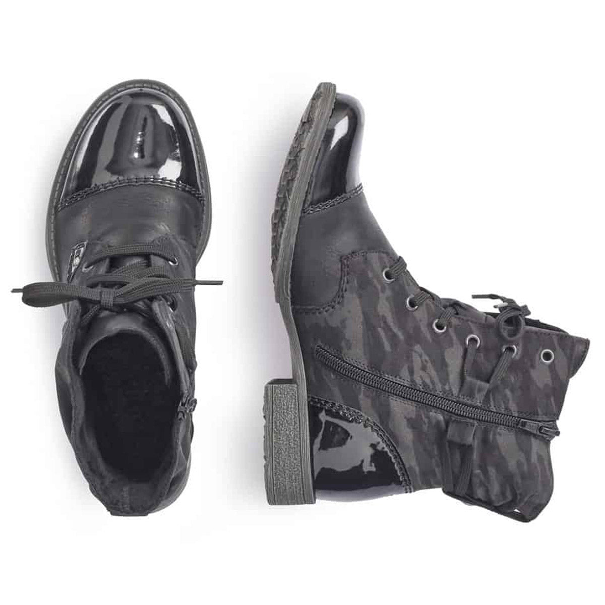 A pair of mismatched shoes: one black dress shoe and one Rieker lace-up bootie in the RIEKER LACE UP BOOTIE BLACK CAMO PRINT - WOMENS style, both isolated on a white background.