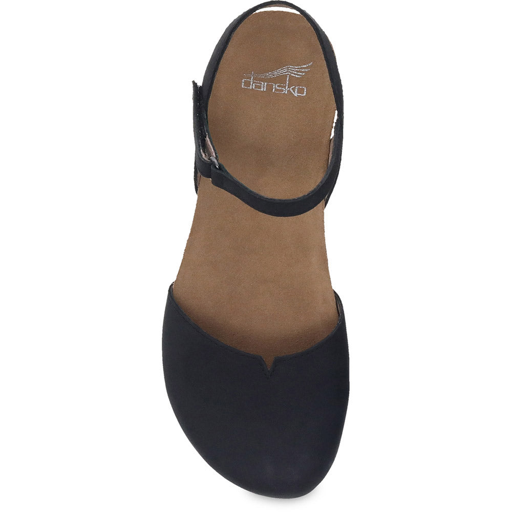 Top-down view of a black mary jane style Dansko Rowan Black Nubuck women’s shoe with a memory foam footbed and a strap over the instep.