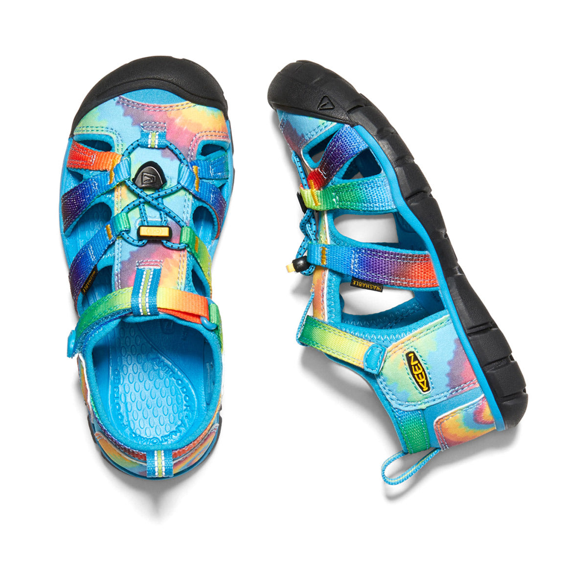 A pair of colorful Keen KEEN CHILD SEACAMP II CNX VIVID BLUE TIE DYE - KIDS hybrid water sandals viewed from above.