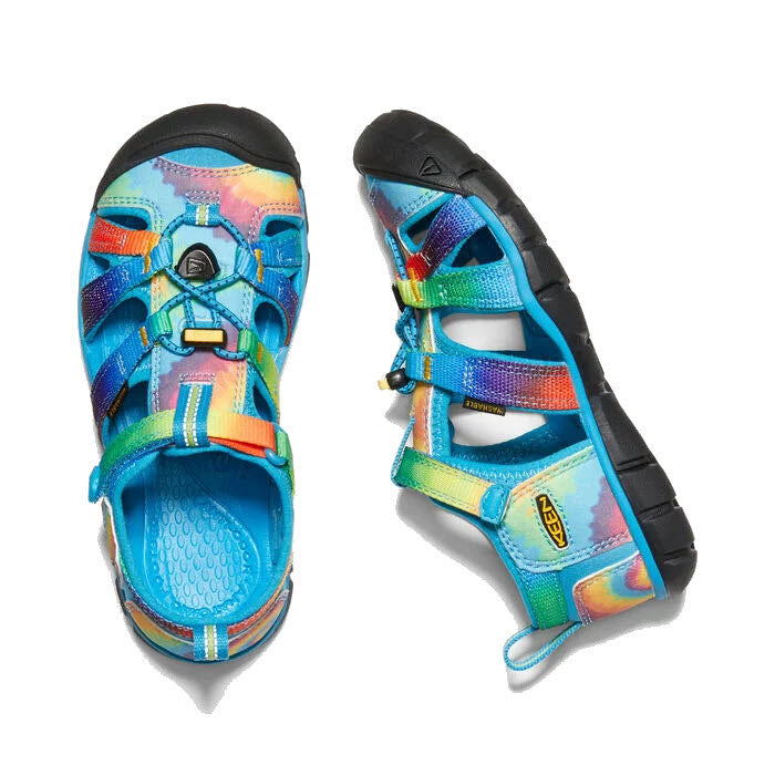 A pair of colorful Keen Tots Seacamp II CNX Vivid Blue Tie Dye - Kids hybrid water sandals with a Secure Fit Lace Capture System and adjustable straps viewed from above.