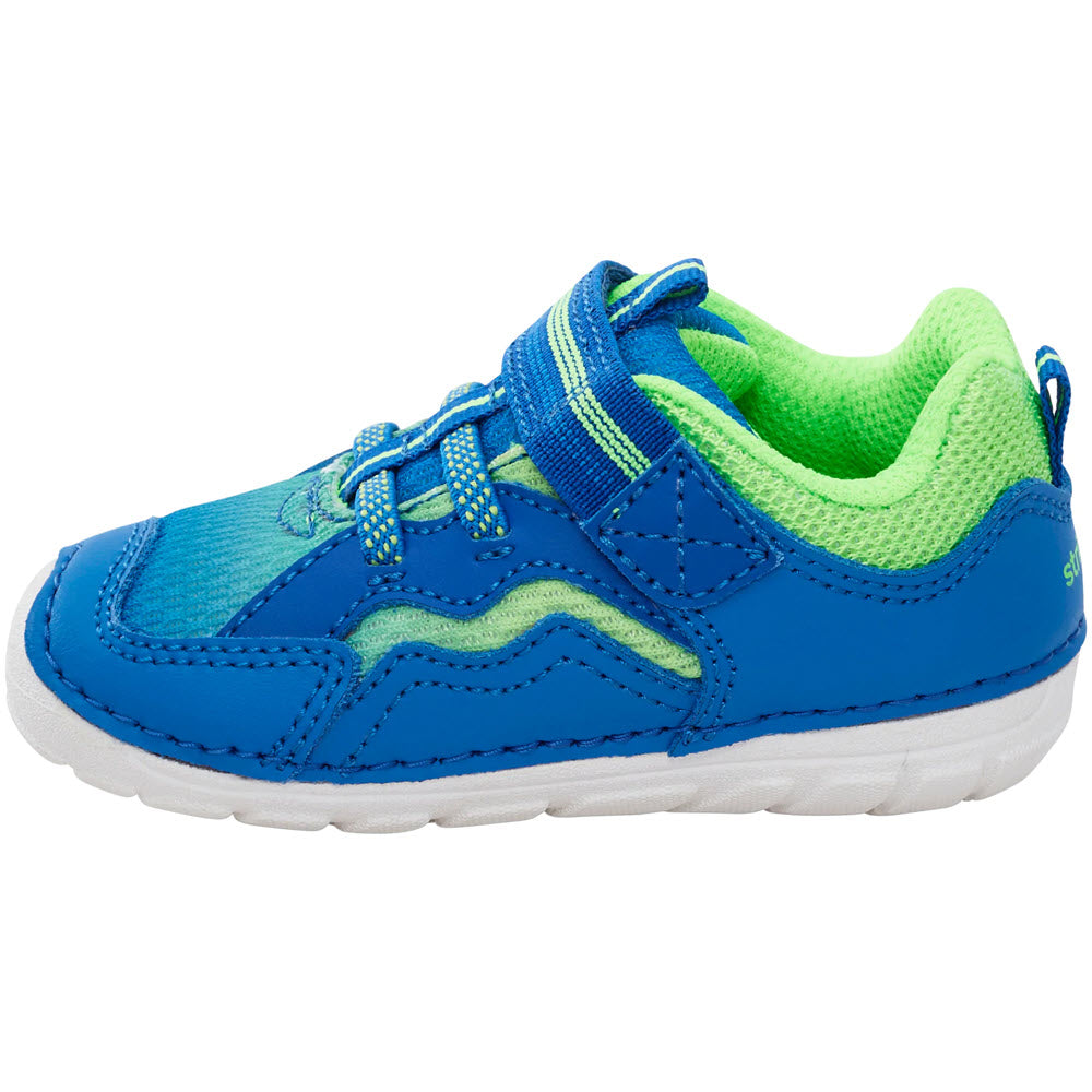 Stride Rite&#39;s STRIDE RITE SOFT MOTION KYLO BLUE/LIME - TODDLERS sneaker is an APMA-approved blue and green children&#39;s sneaker with a velcro strap.