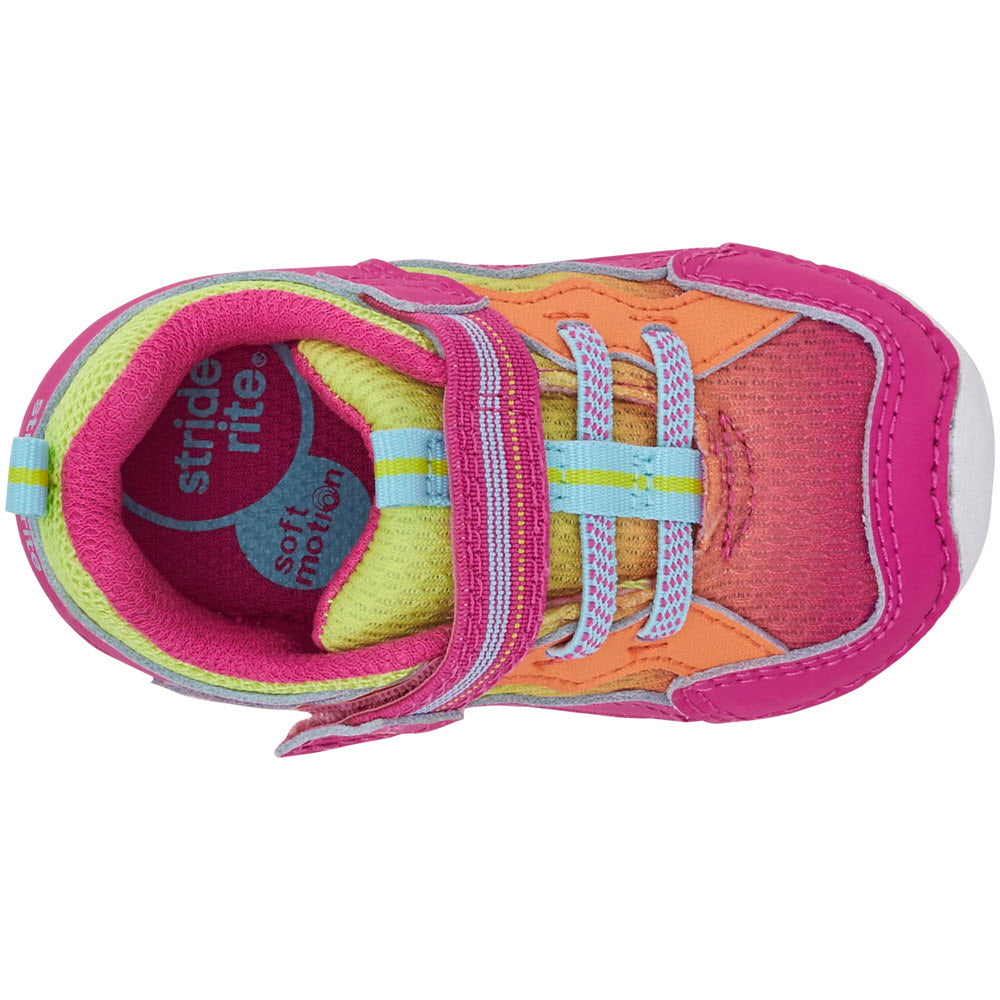 Top view of a colorful Stride Rite Soft Motion Pink Neon - Toddlers Sneaker, a child&#39;s shoe with velcro straps.