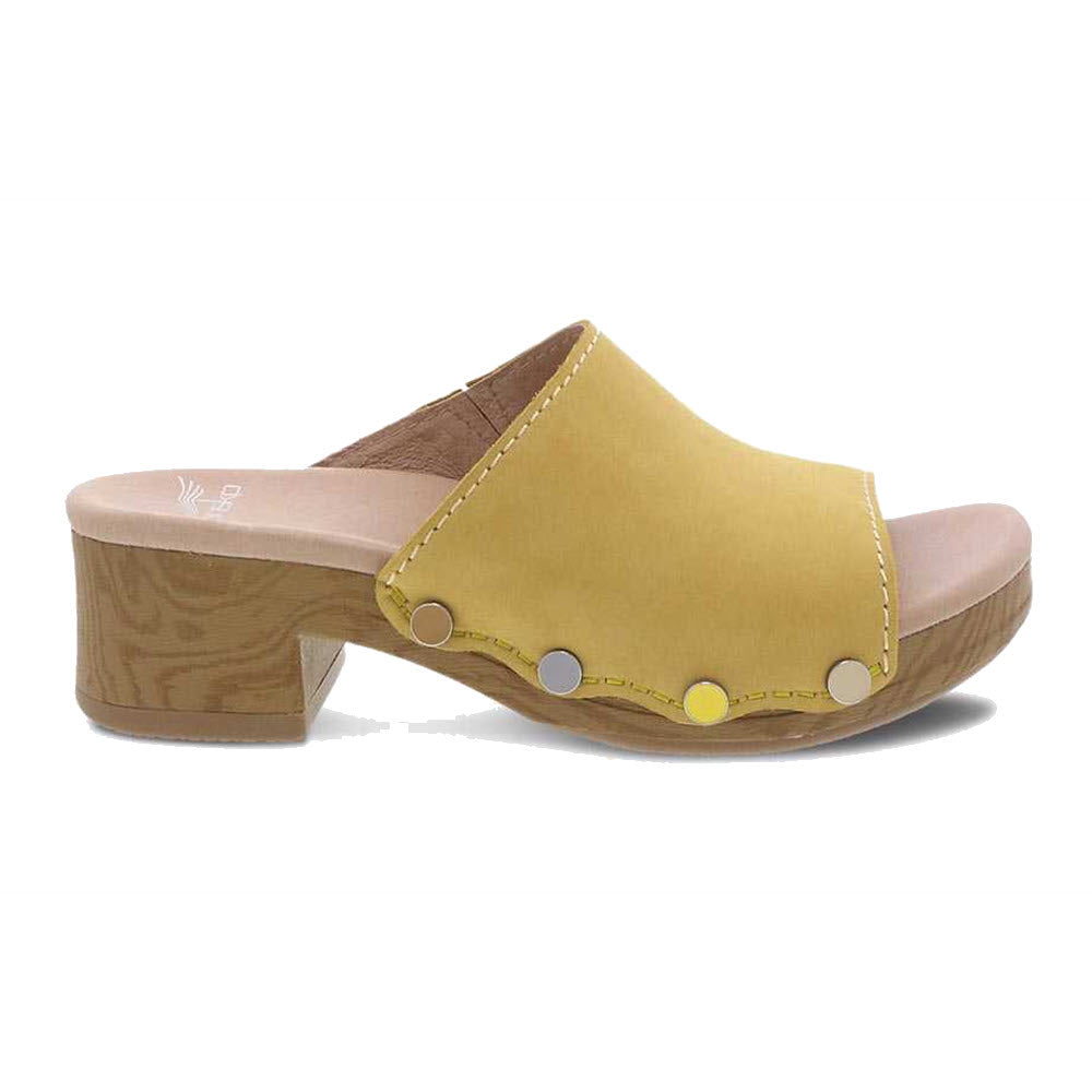 A yellow Dansko Giana Yellow Milled Nubuck slide with a wooden block heel on a white background.