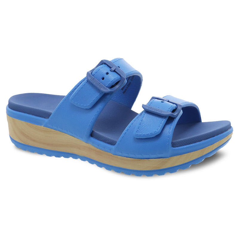 Dansko Kandi blue platform sandals with buckle straps, perfect for summer adventures.