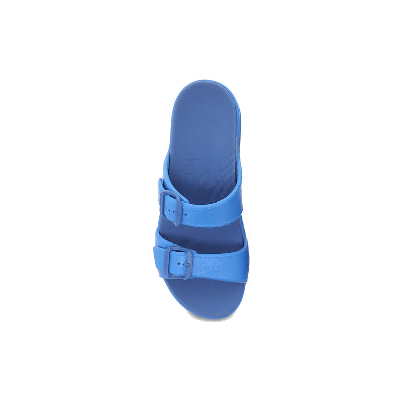 A single blue Dansko Kandi summer sandal with adjustable straps, viewed from above.