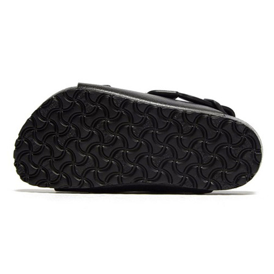 Black Birkenstock Milano EVA shoe with a wavy sole pattern.