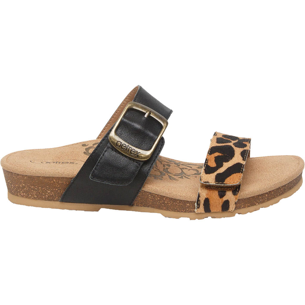 A single cork footbed sandal with leopard print strap and adjustable straps: Aetrex Daisy Leopard Sandal.