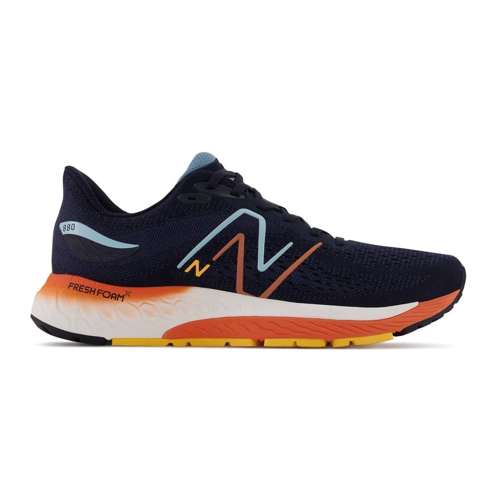 A new balance 880v12 Eclipse/Vibrant Apricot running shoe with a dark blue engineered mesh upper, a large orange "n" logo, and a white and orange sole with "Fresh Foam X 880v12" text.