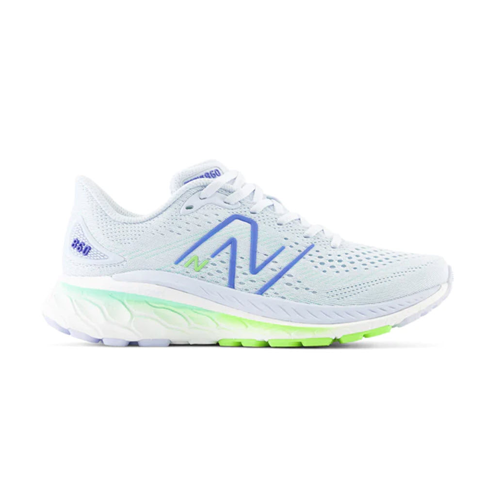 A side view of a New Balance Fresh Foam X 860V13 Starlight/Pixel/Lapis stability running shoe with a white and light blue upper, prominent logo on the side, and a vibrant green accent near the sole.