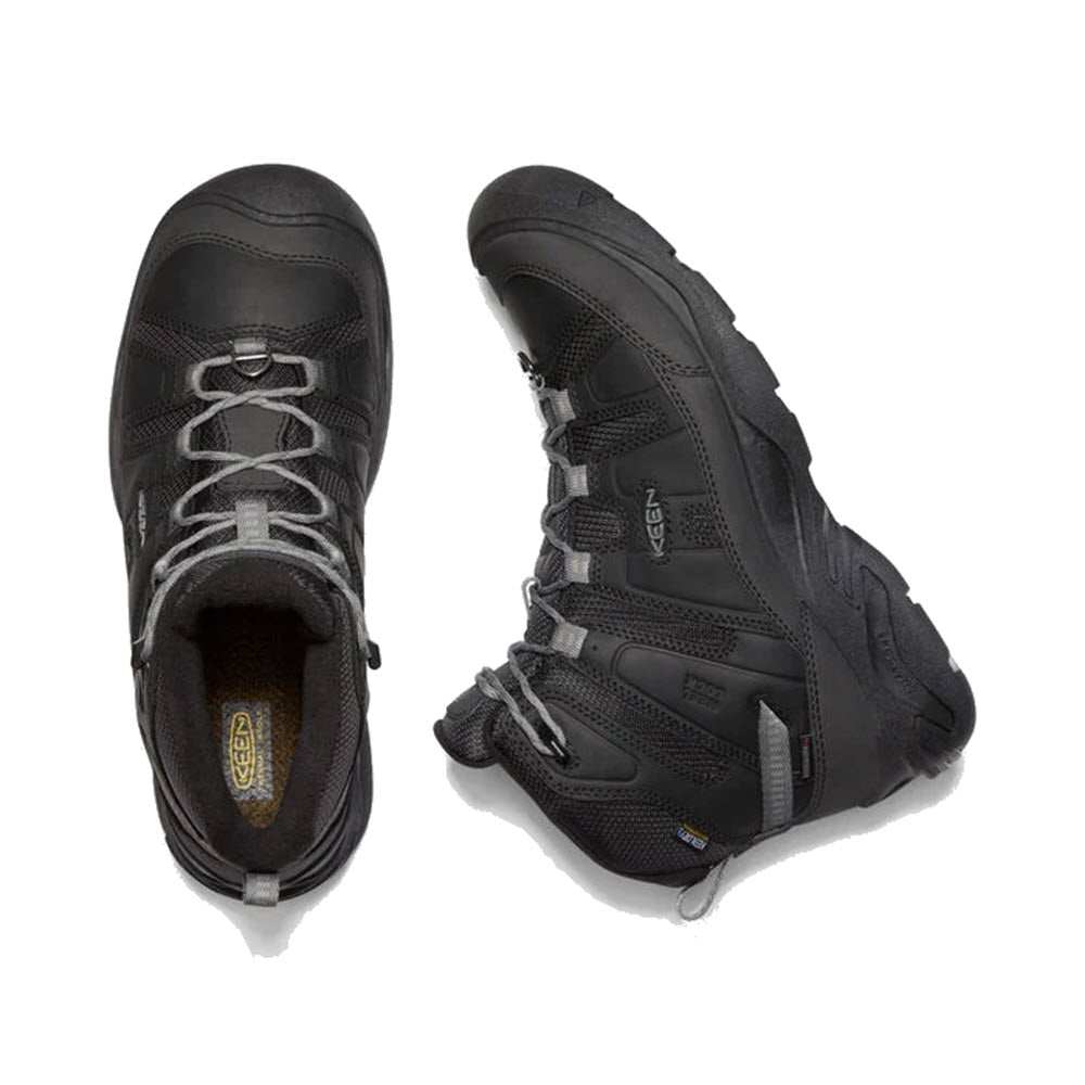 A pair of black insulated waterproof Keen hiking boots viewed from above, showing the top and side profile.