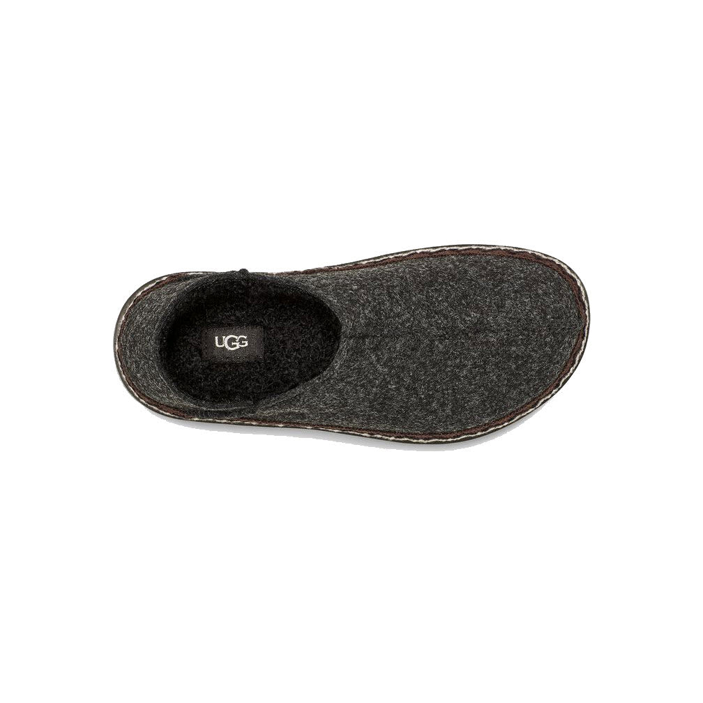 Top view of a single black UGG Refelt Tasman slipper made from TENCEL™ Lyocell on a white background.