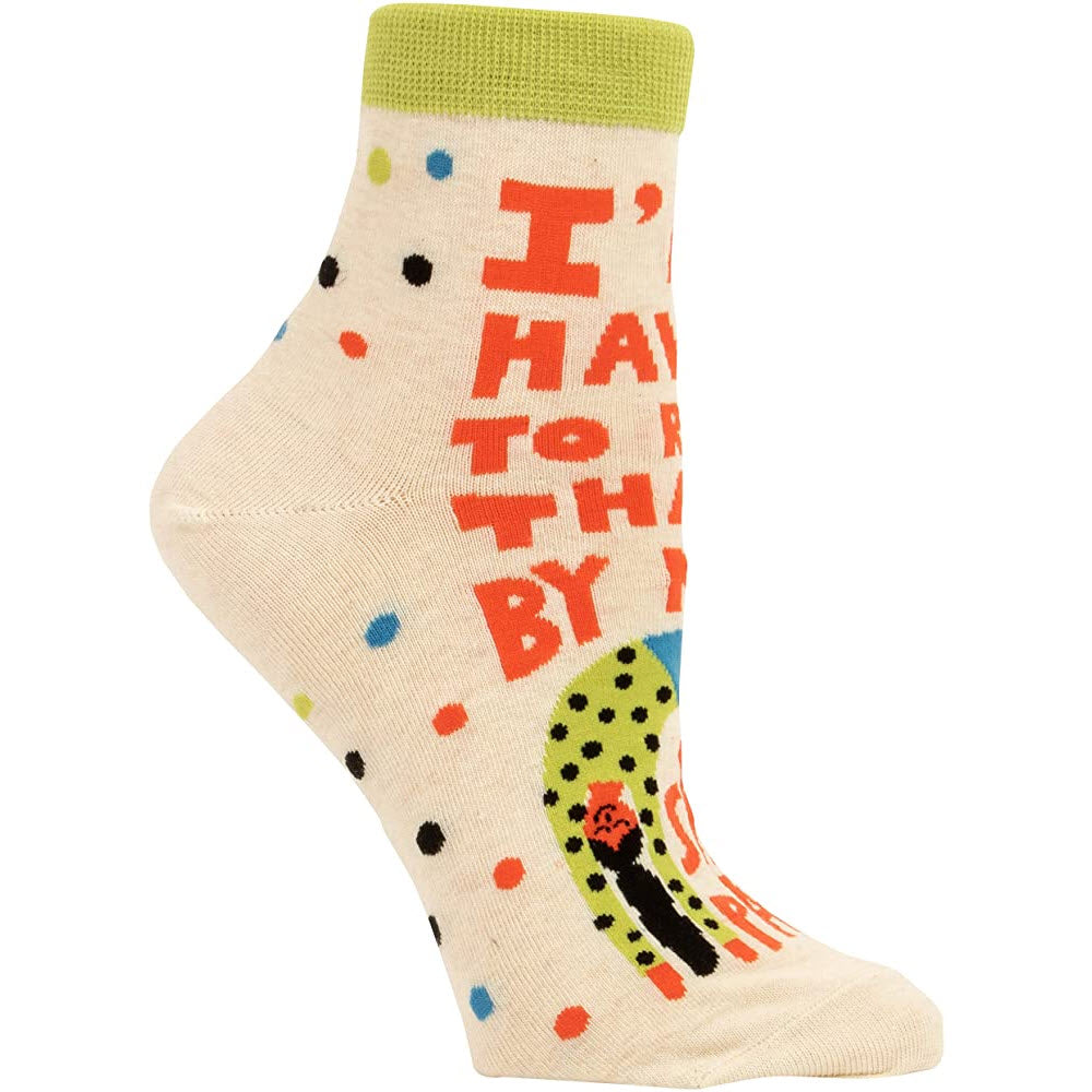 A single, colorful BLUE Q ANKLE SOCKS RUN THAT BY MY SWEATPANTS with the phrase "i hate this" and various polka dots and a graphic of a dinosaur, fits women's shoe size 5-10.