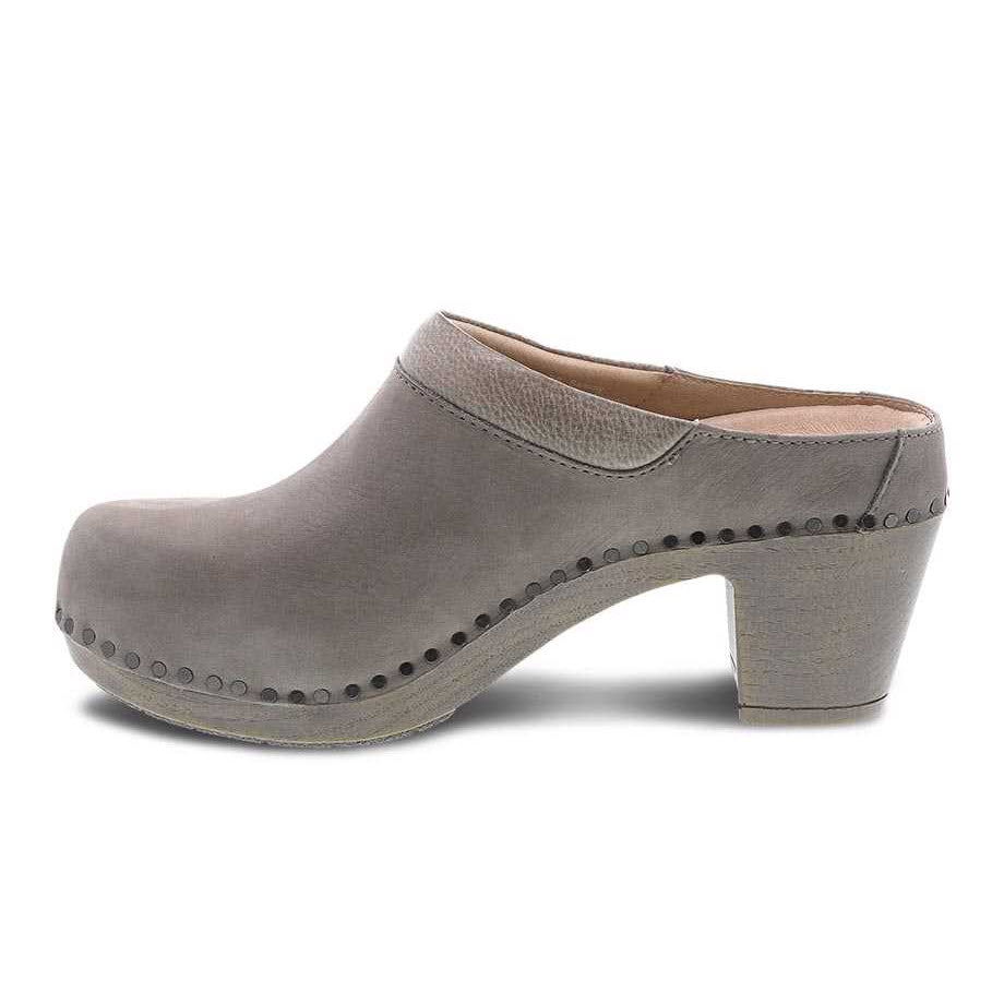 Gray leather clog with wooden heel, decorative studs, and Dansko Natural Arch technology. --&gt; DANSKO SAMMY TAUPE NUBUCK - WOMENS by Dansko
