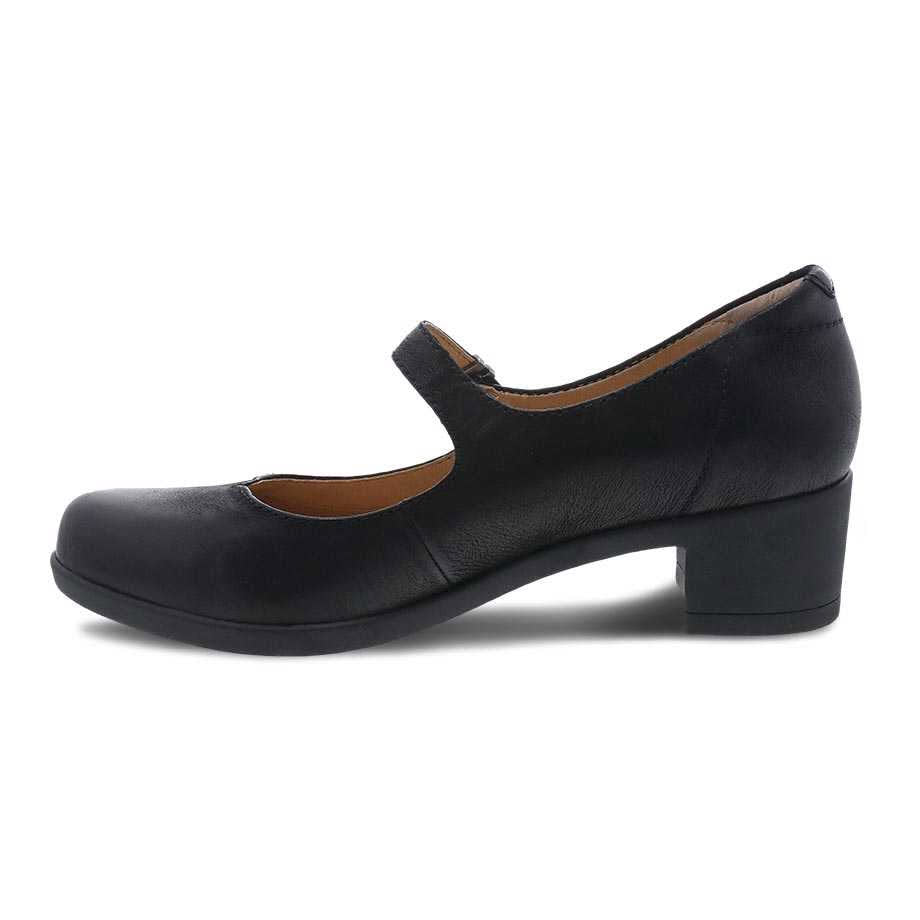 Dansko Callista black burnished Mary Jane style shoe with leather uppers and a low heel on a white background.